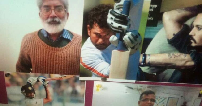 A magenta office pinboard with printed photographs pinned to it, including a portrait, a cricketer mid-shot and a family snapshot